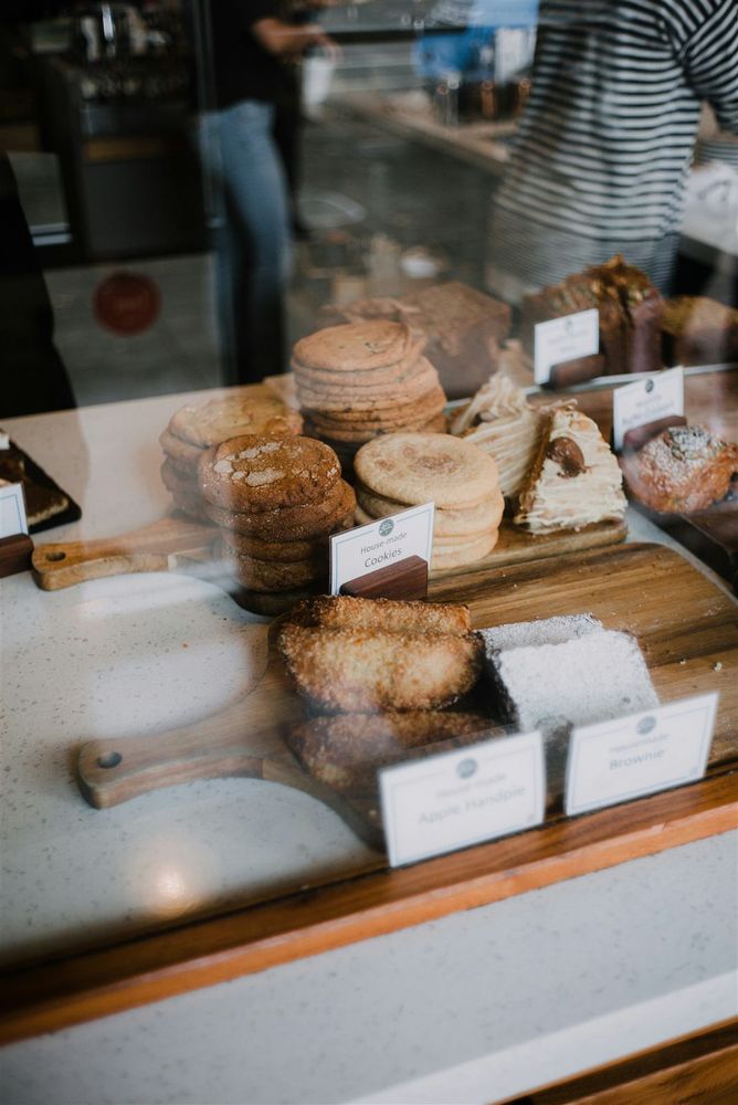 Inside the bakery: pastry case and coffee bar
